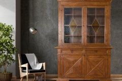 Black leather armchair and lamp in living room interior with plant,concrete wall.